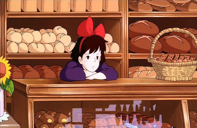 On a day without customers, Kiki fights off boredom at Osono's bakery.