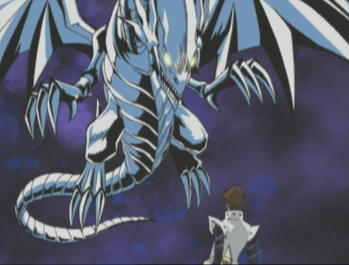 Seto Kaiba is confronted by a Blue-Eyes White Dragon summoned by the Duel Machine in a scene from Episode 54 of the Yu-Gi-Oh! TV anime.