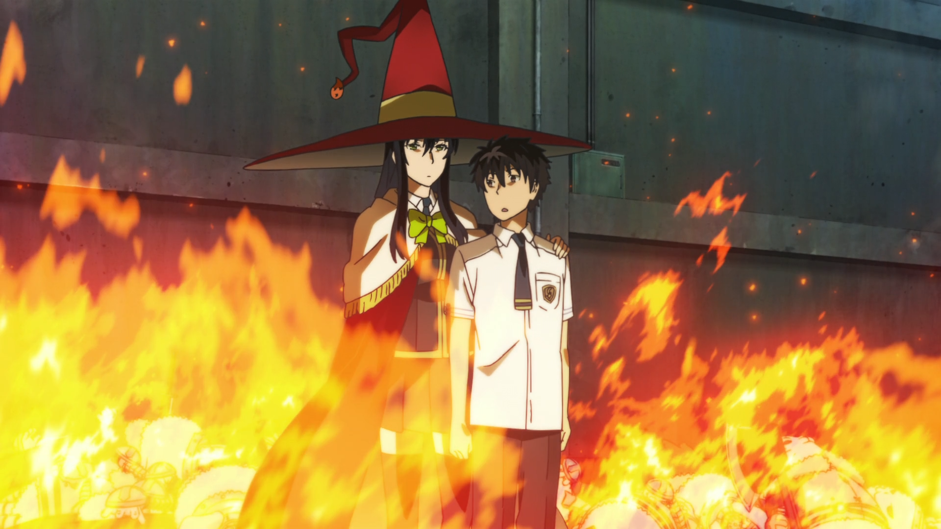 Ayaka Kagiri, the Witch of Flames, protects her charge, Honoka Takamiya, with a shield of fire in a scene from the Witch Craft Works TV anime.